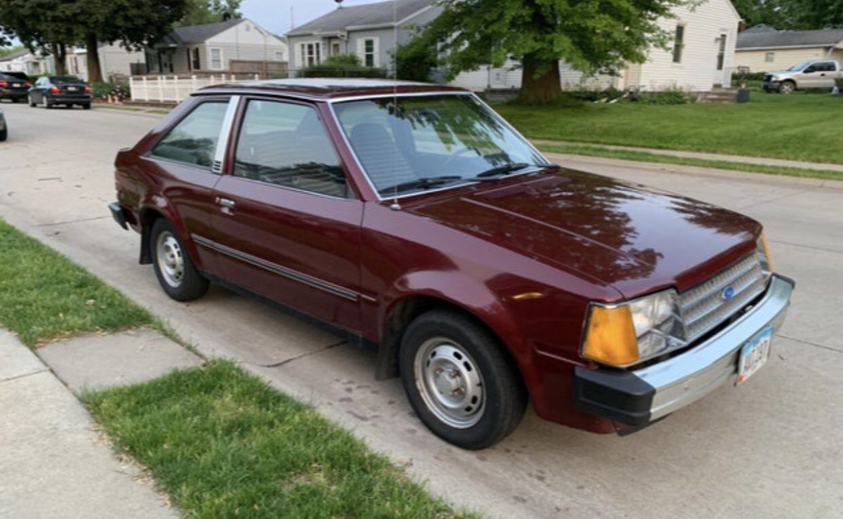 penelopemb's tweet photo. @Joshua_Ariza 83 Ford Escort, white, inherited from my dad. 4-speed manual and AM radio, which I upgraded to AM/FM with cassette deck. Engine blew moving to college freshman year ☹️ (not my photo) https://t.co/jPGRPcvqA3