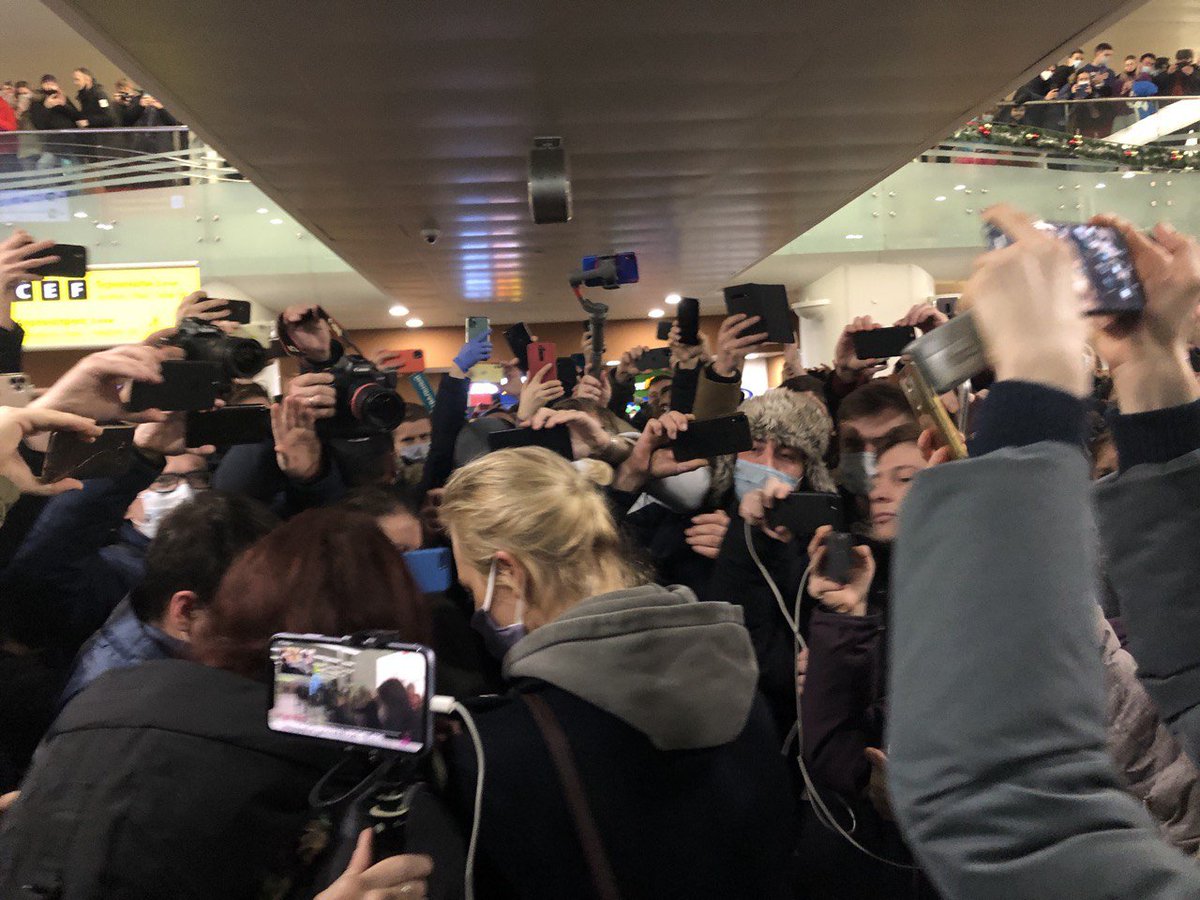 Navalny remained in transit zone. Yulya, his wife, entered the airport to a crowd of supporters chanting her name