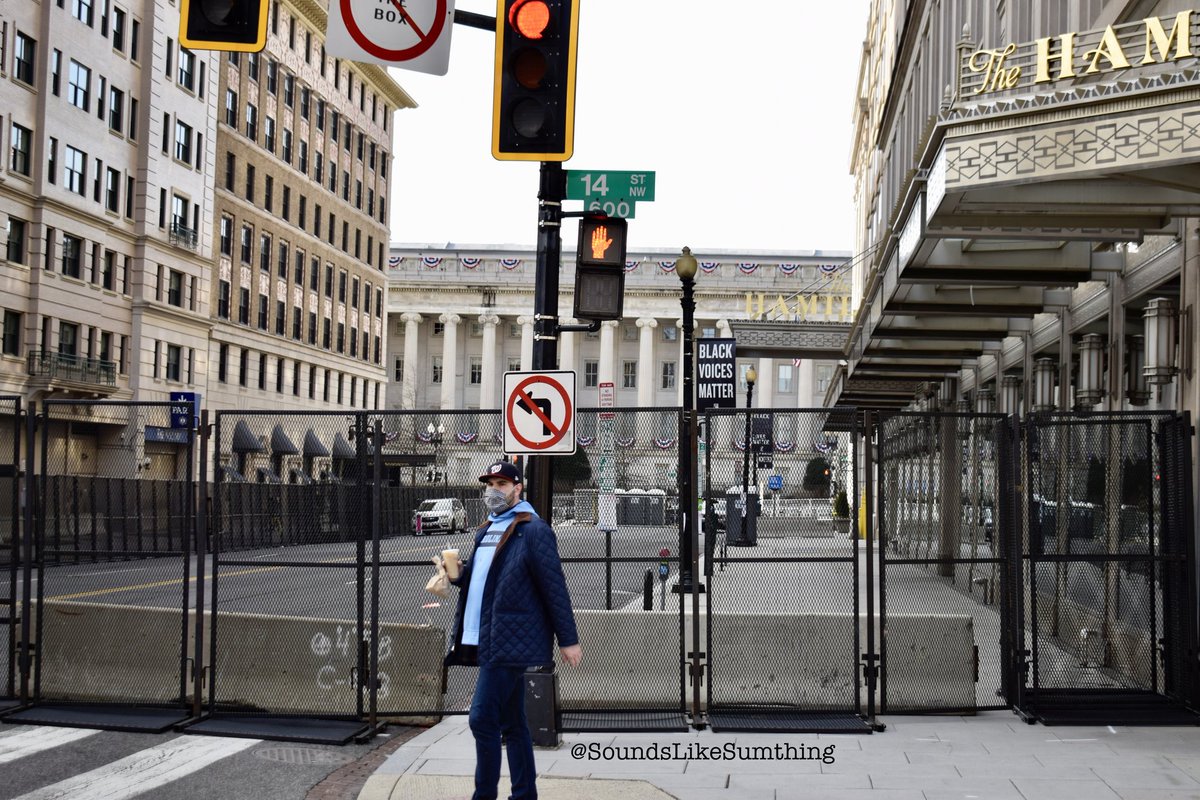 Residents of DC going about their normal day while the city turns into a fortress