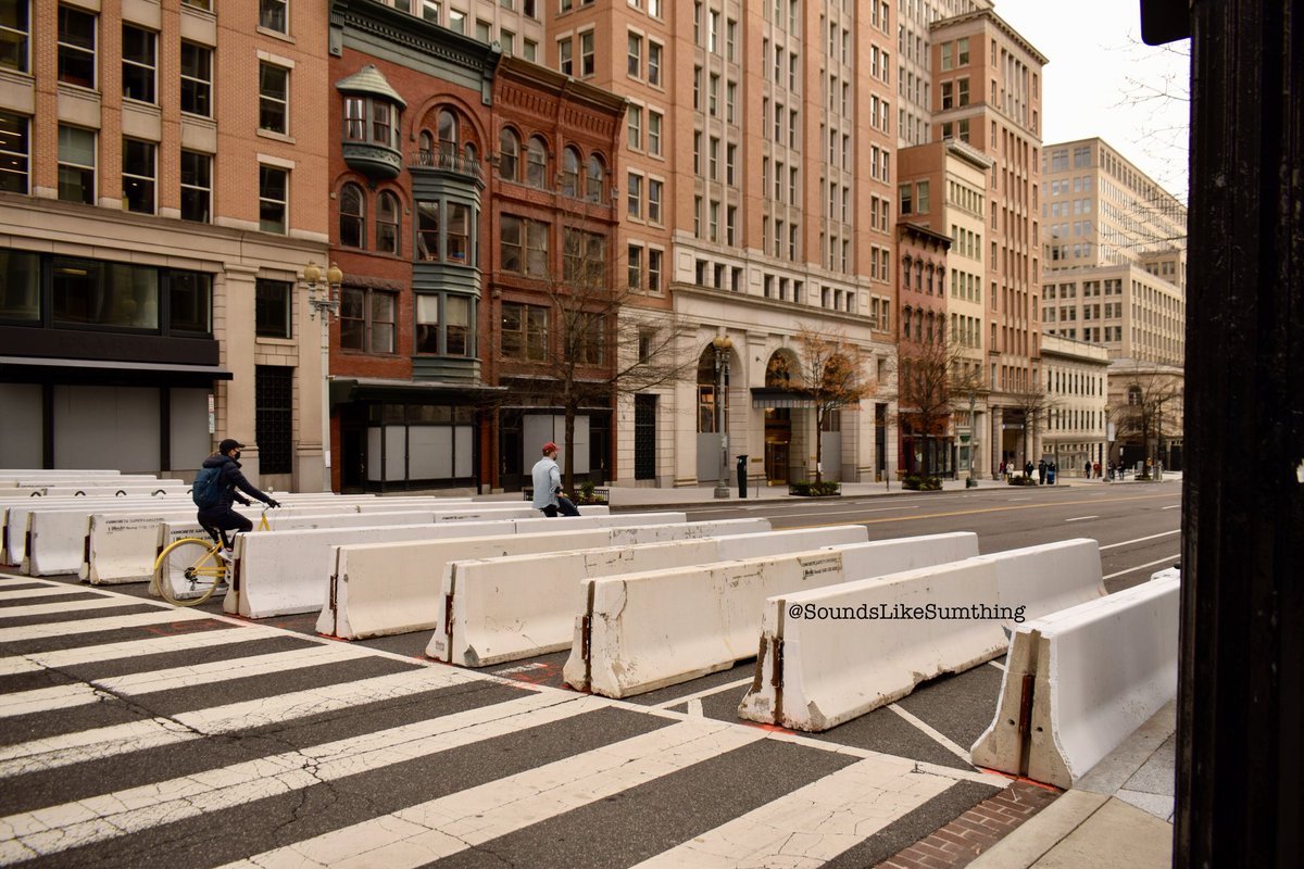 This is one of my favorite series of shots I took. People riding bikes right through the barricades