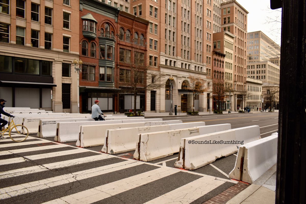 This is one of my favorite series of shots I took. People riding bikes right through the barricades