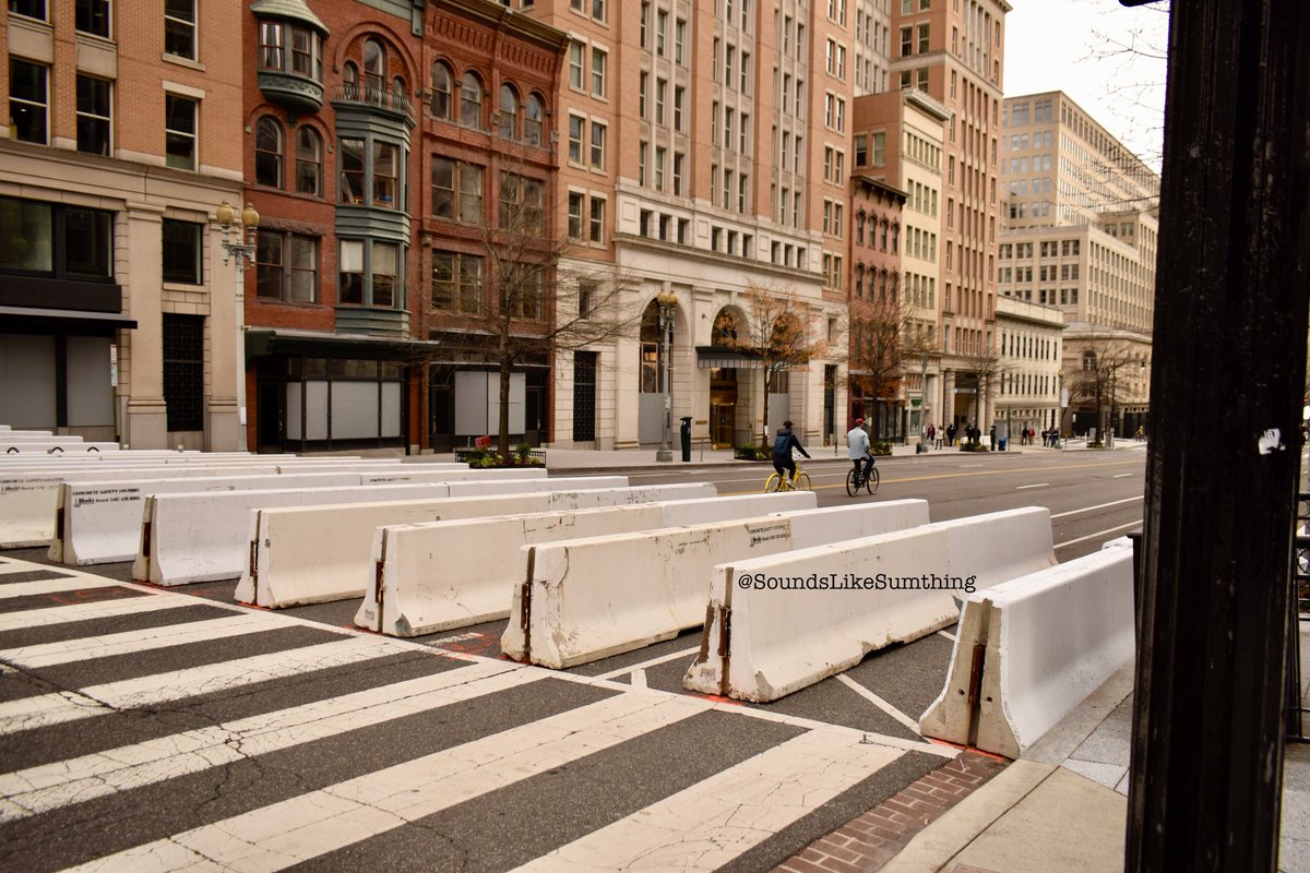 This is one of my favorite series of shots I took. People riding bikes right through the barricades