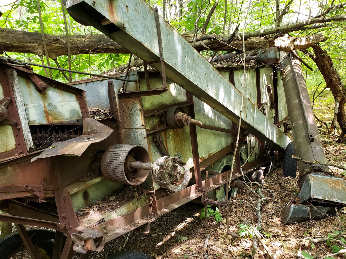 germaniatimber's tweet photo. As some #farmland in #CentralWisconsin naturally returns to #forest, old #farm implements left on the edges of fields become relics. Here is a 1930s era Avery #threshing machine now #abandoned and tree-locked on what was once a farm road. Its value today is the history it tells. https://t.co/Q3JnD8ZQMi