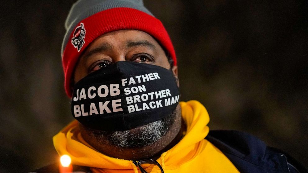 Jacob Blake Sr., father of Jacob Blake, holds a candle at a rally on Jan. 4, 2021, in Kenosha, Wis. (Photo: Morry Gash/AP)