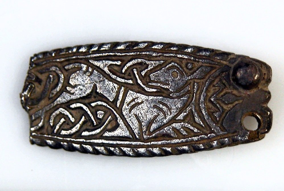 A late 9th-century Anglo-Saxon silver strap-end with zoomorphic Trewhiddle-style decoration, found near Maidstone, Kent:  https://finds.org.uk/database/artefacts/record/id/109499