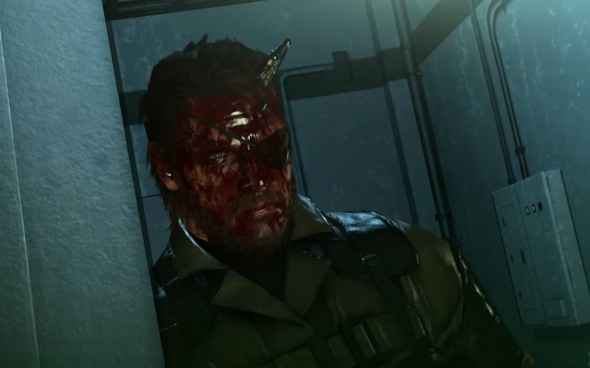Venom Snake (Big Boss) moments before his final battle with Solid Snake in MG1. The Diamond Dogs logo in the background even turns into an Outer Heaven logo.