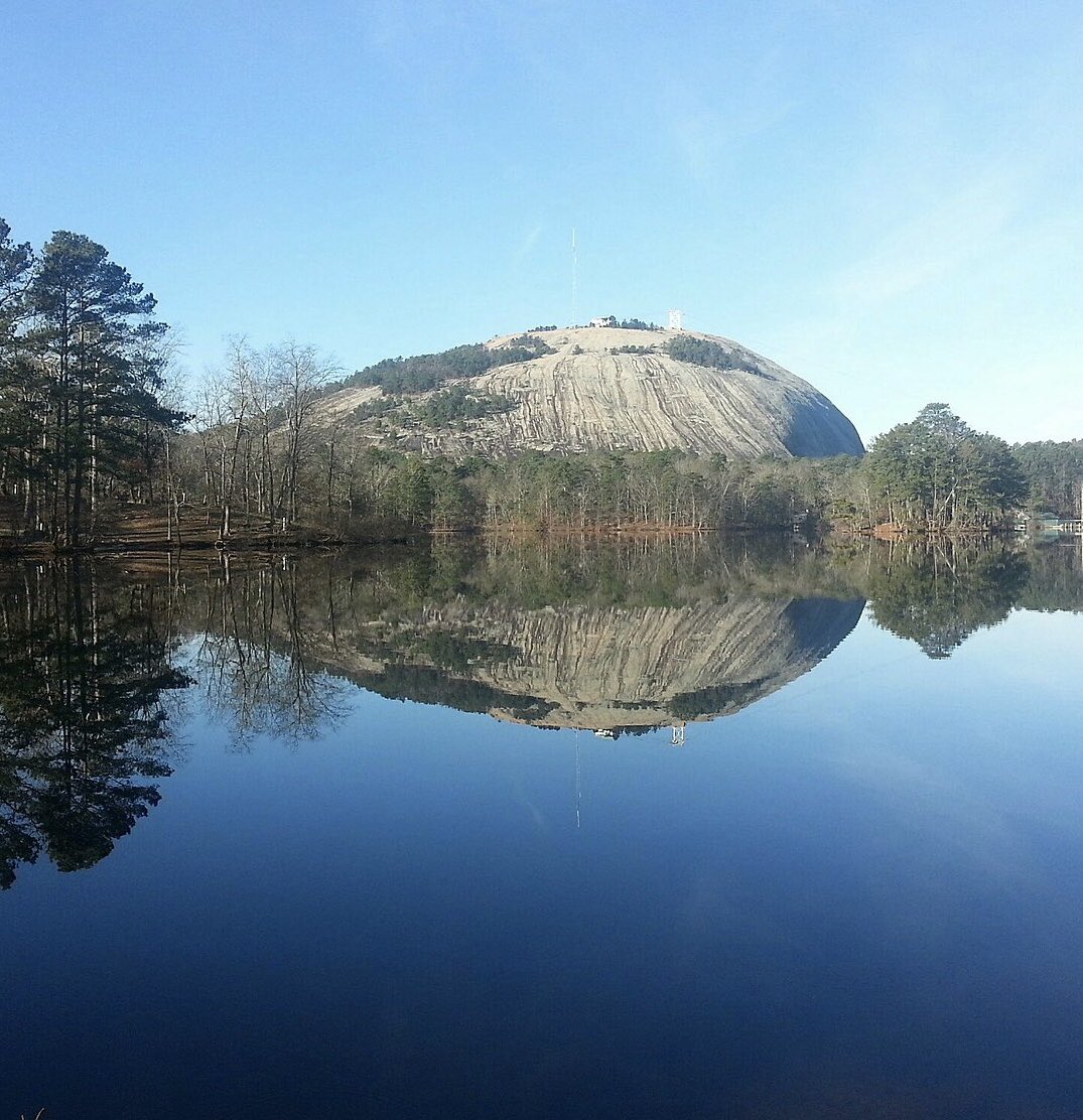 cambronious's tweet photo. This pic of Stone Mountain, located in DeKalb County GA, framed by the blue sky and water is pretty fitting right now. #DeKalbcountyGeorgia #flipga #bluewave https://t.co/1JMSB3LgEo