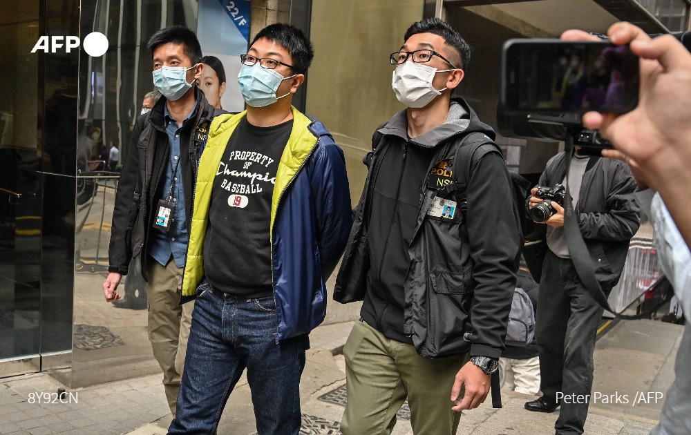 AFP's tweet photo. #UPDATES China's crackdown in Hong Kong escalates dramatically with police arresting as many as 50 opposition figures, most on a charge of “subversion,”  in their largest operation since a draconian security law was imposed https://t.co/twUsQ5ndVM https://t.co/ZWCwBUs9og