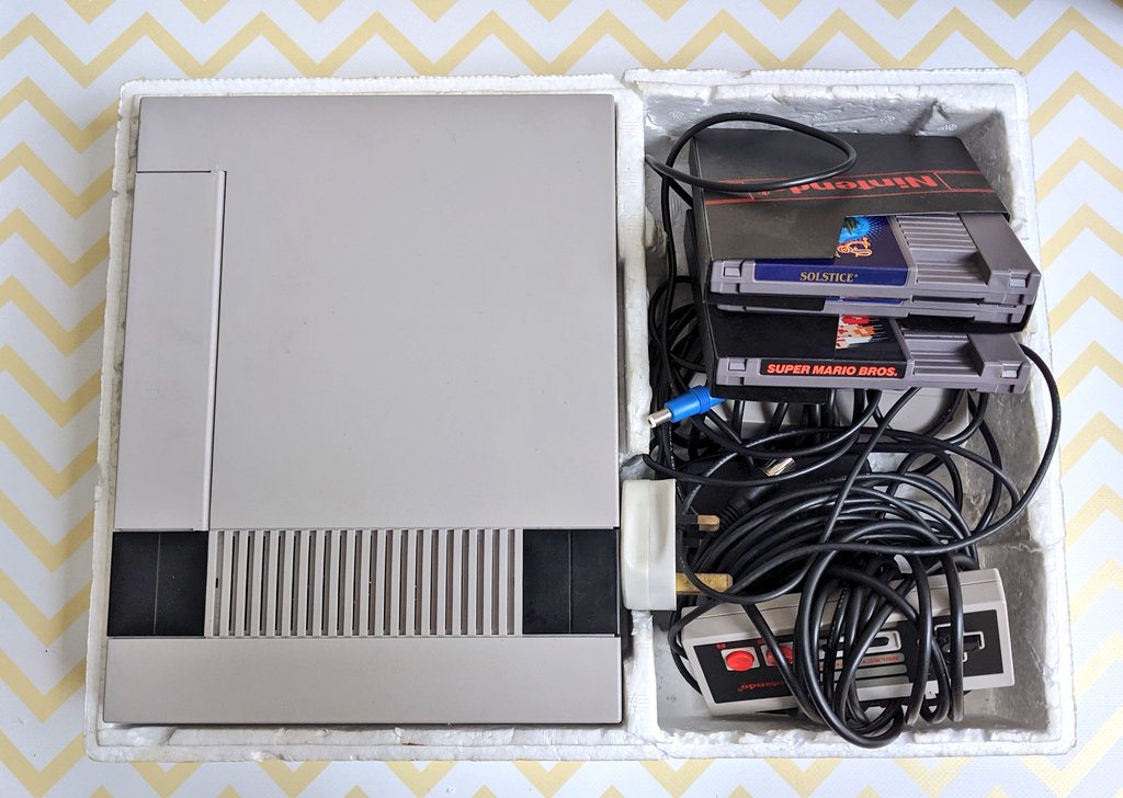 And yes, you had better believe that's the original styrofoam packaging too. Along with the plug my dad had to wire onto it so I could play it! I had two controllers, and my NES came with Mario. I bought two games with it too, Solar Jetman and Solstice