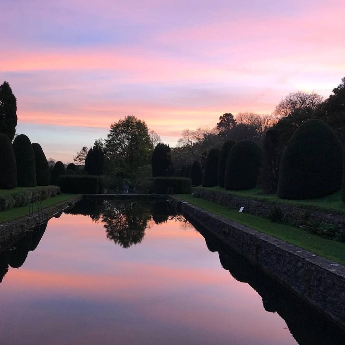 Throwback to just over a year ago with this stunner of a sunset across the Reflecting Pools at Mapperton Gardens, winner of the <a href="/Historic_Houses/">Historic Houses</a> 2020 Garden of the Year award.  

📷With thanks to our head gardener <a href="/stevelannin/">Steve</a> for the perfectly captured image