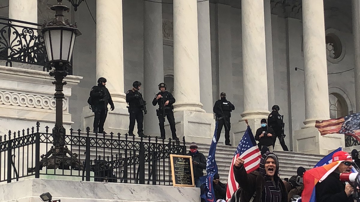 They did it. Trump supporters broke the police line and have rushed to the top of the steps. They’re shouting “USA!” and “four more years!” One man is shouting Q conspiracies into a megaphone. The police set off one stun grenade at first, but now seem to be letting them be.  #DC