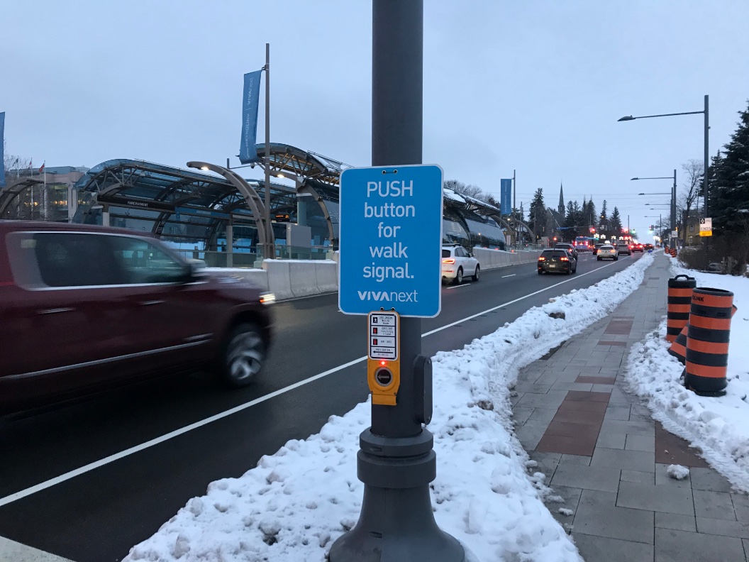 The Hopkins street intersection is one of the biggest flaws in this design. It is a semi-actuated intersection, meaning that the lights will change only when a car is waiting to turn, or the pedestrian button is pushed. The lights are timed to change with those at Major Mackenzie