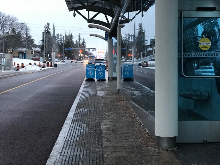 To rectify this, temporary construction cones and cone bars were installed at the north end of the station on both sides of the roadway. This did little to deter people from crossing here, with many instead choosing to walk down the rapidway lanes instead.