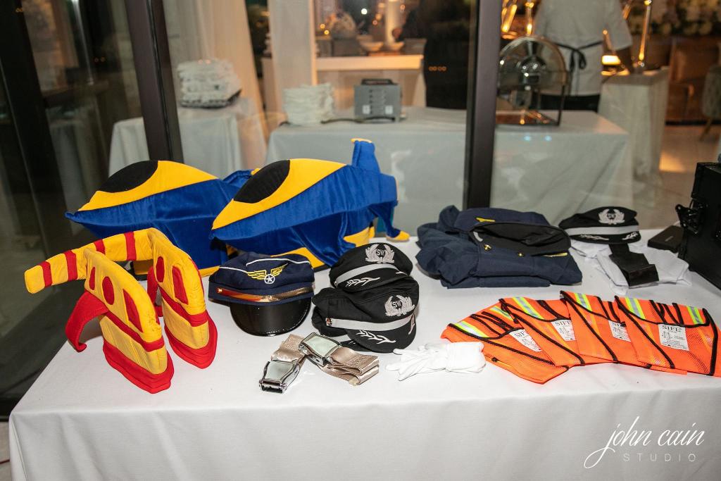 The wedding was one year later, complete with a Southwest exit row photo booth, Southwest snacks in the guest boxes, and more. BUT WAIT- it gets cuter. (5/7)