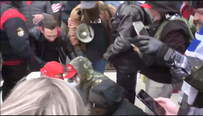 15/ A Stop the Steal attendee has been pepper-sprayed and is being ministered to by several members of the crowd, as others livestream.