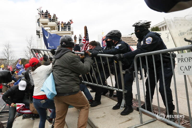 Supporters of President Trump clash with police officers outside of the U.S. Capitol Building. More photos:  http://reut.rs/38mioh8&nbsp;   @LeahMillis