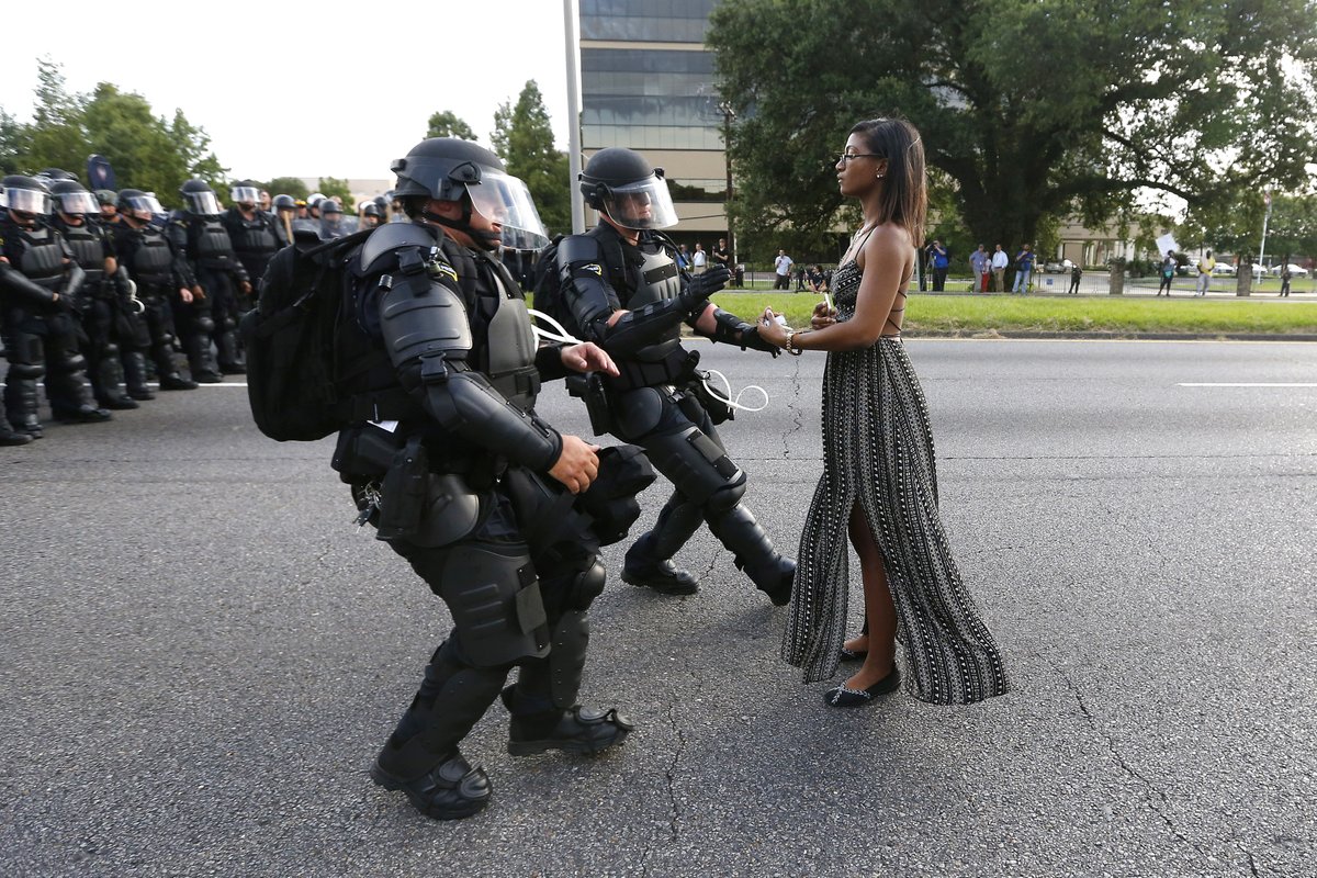 SuperDenDen's tweet photo. As I see all these protesters storming the #CapitolBuilding  vying for a #coup with little police intervention, I can't help but remember @IeshiaEvans was met with a full riot team for standing in the street in 2016. https://t.co/AXKN8msqjv