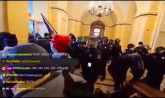 Per one of the livestreams, it seems a whole phalanx of security are escorting the protesters out of the capitol.