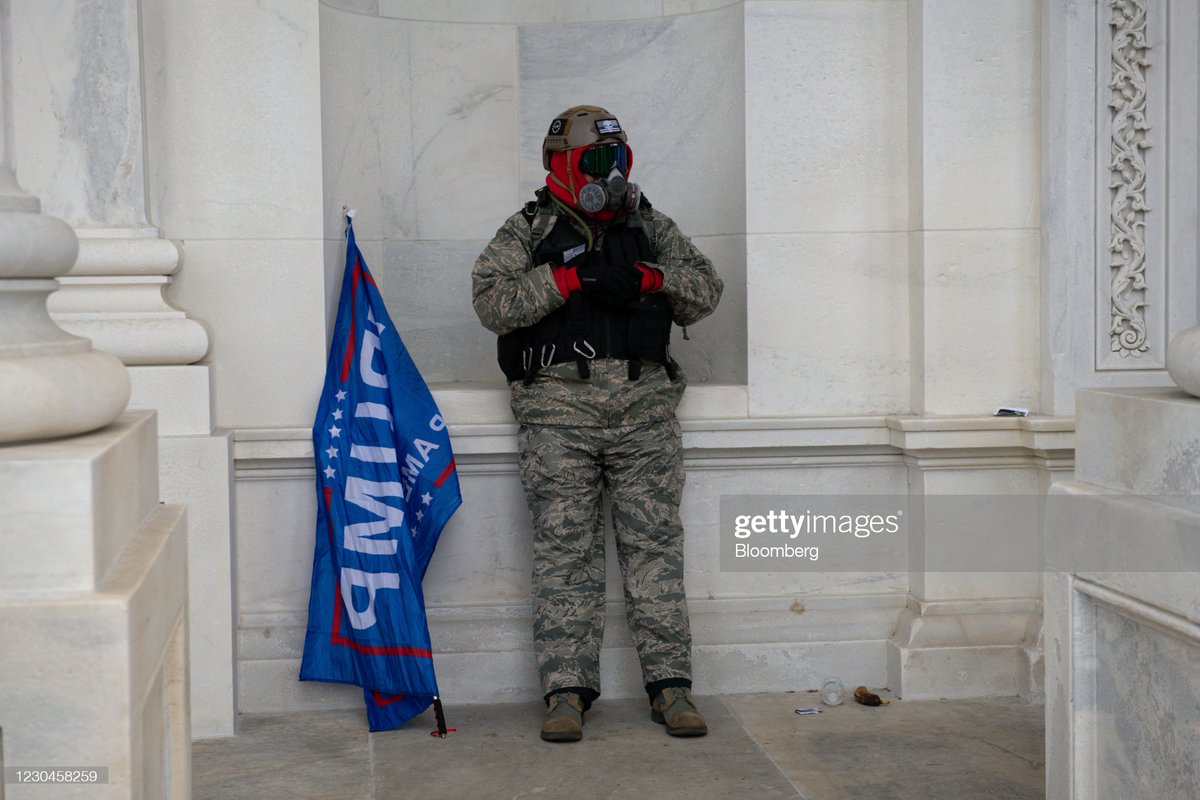 A demonstrator rests outside the U.S. Capitol after breaching security fencing during a protest in Washington, D.C., U.S., on Wednesday, Jan. 6, 2021.