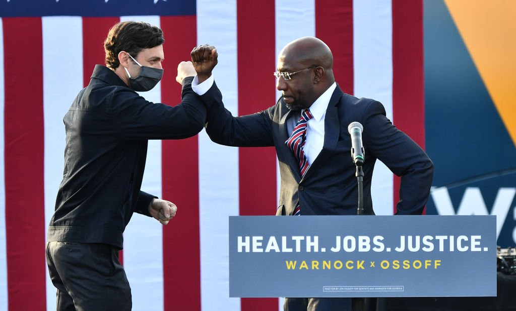 Bossip's tweet photo. Game! Blouses! Raphael Warnock &amp; Jon Ossoff Give Bad-Faith Bureaucrats BLUE Balls With Nail-Biting, Bigot-Rebuking, Thank-God-For-Black-Ballots Victory Over COVID-Cashing KKKelly Loeffler &amp; Pandemic-Profiteering David Perdue 

(Paras Griffin / Getty)

https://t.co/R7UkQRmCb0 https://t.co/kb1y1XHE4z