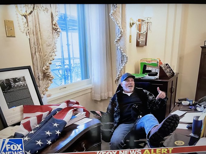SkylineReport's tweet photo. Thug sitting in Nancy Pelosi's chair in her office.

This is NOT a protester.

This is a terrorist.

He needs to be treated as such.

#Georgia https://t.co/0ipdLUFiK5