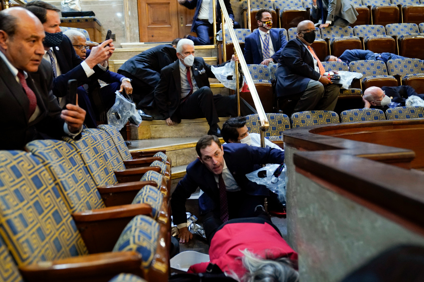 JonMurray's tweet photo. Photo of the day (one of many), U.S. Rep. Jason Crow of Colorado and other people shelter in the House gallery as a mob of pro-Trump supporters try to break into the House Chamber. (AP photo) https://t.co/3cvVyr1xtH
