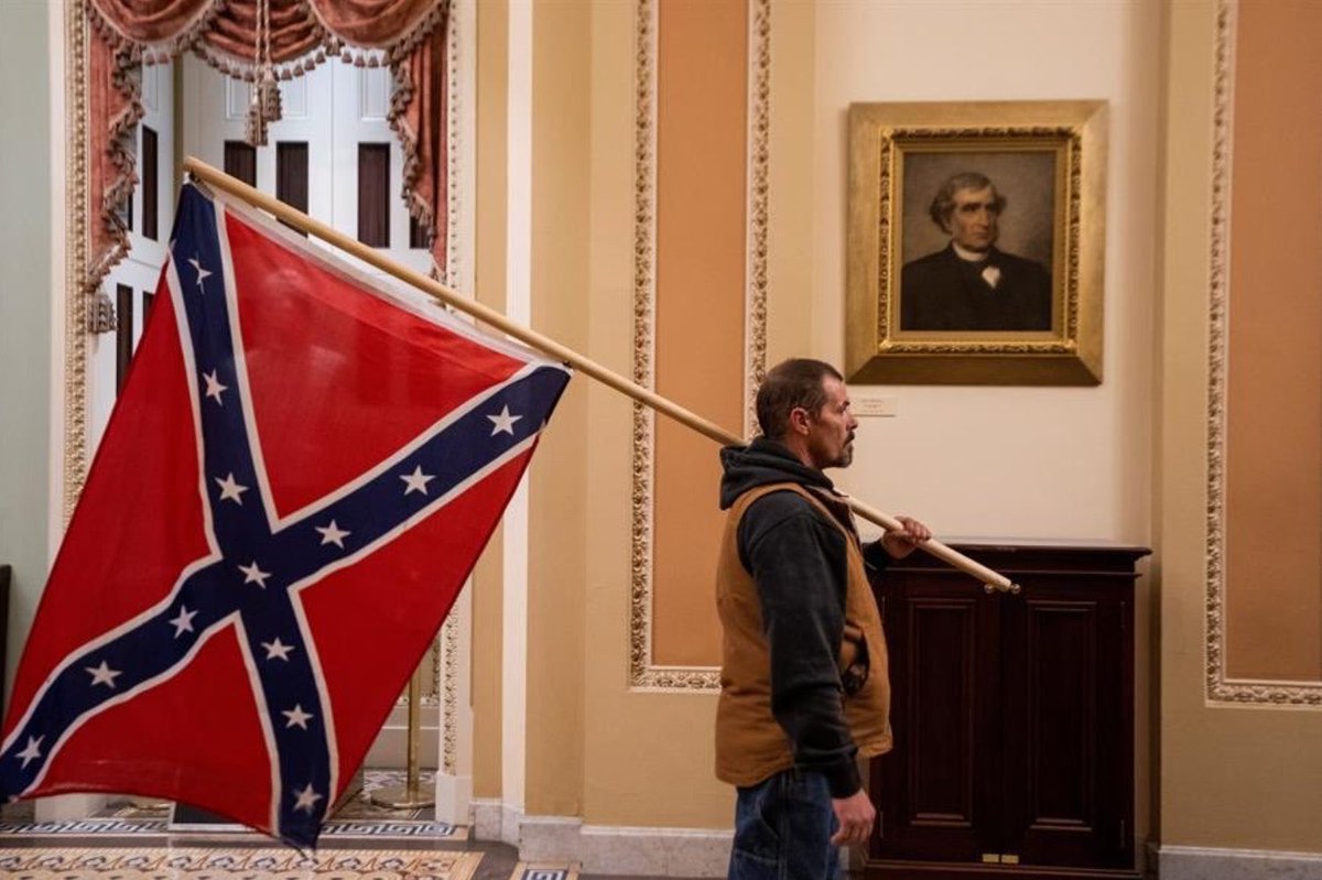 RyRash1051's tweet photo. A lot of images have angered me today but this one really got me. During the Civil War the Secessionist’s battle flag never got close to the capital. Today it walked right through the front door. https://t.co/LD93FGfse5