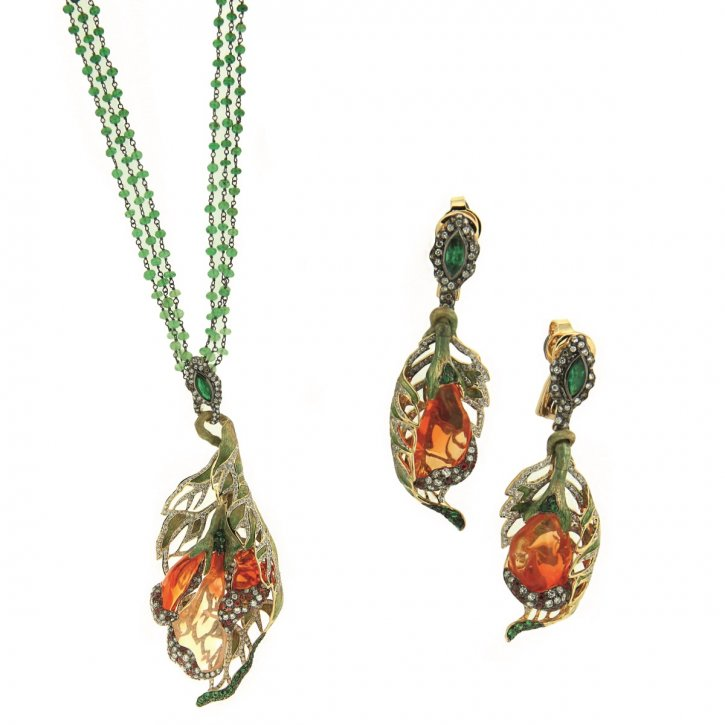 The focal points are the fire opal monarchs leaving the chrysaliseseseses, but the emeralds in the posts of the earrings and loop of the pendant are nice. (Smirti)