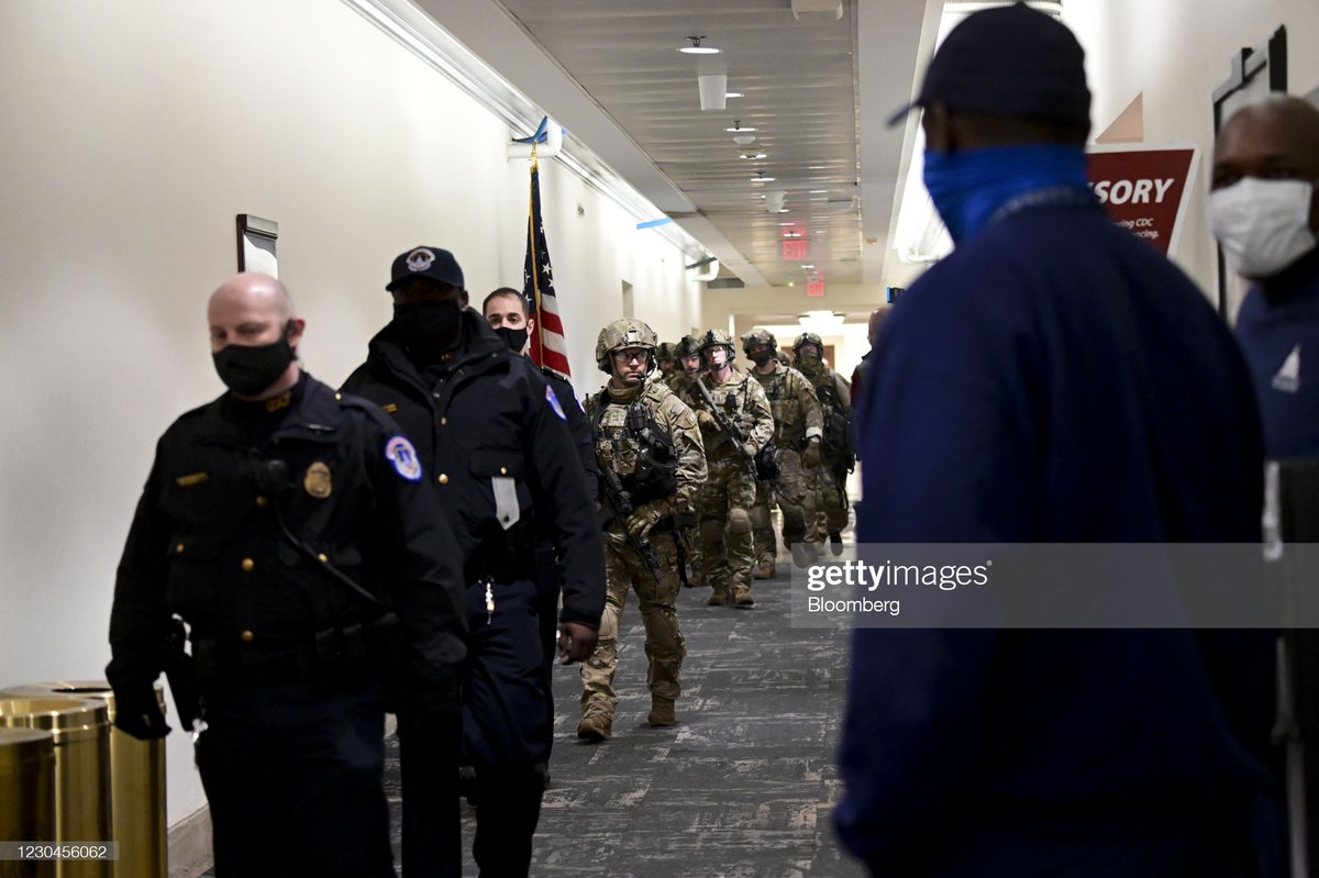 Members of the Federal Bureau of Investigation (FBI) swat team patrol the Longworth House Office building after a joint session of Congress to count the votes of the 2020 presidential election took place in Washington, D.C., U.S., on Wednesday, Jan. 6, 2021.
