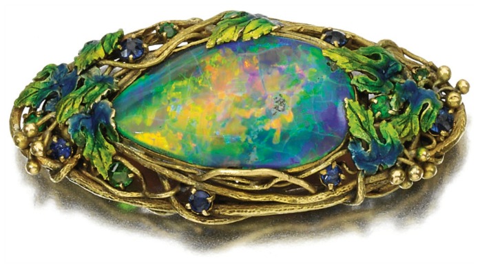 Antique Tiffany that might have emeralds in it, with opal and enamel for sure.