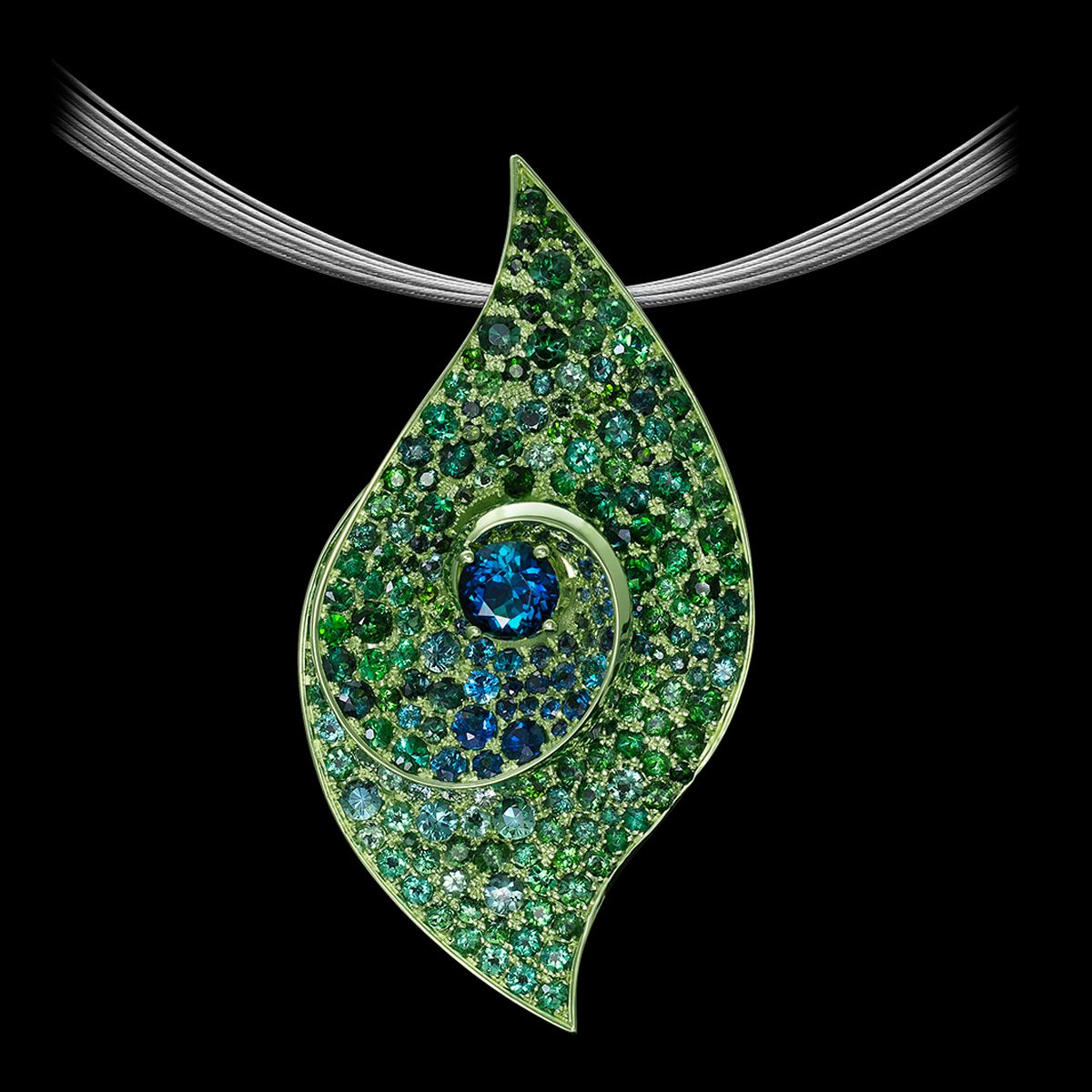 Leaf pendant containing damn near every blue and green stone there is, with green-colored gold. The pendant probably doubles as a brooch because they usually do. (Neely)