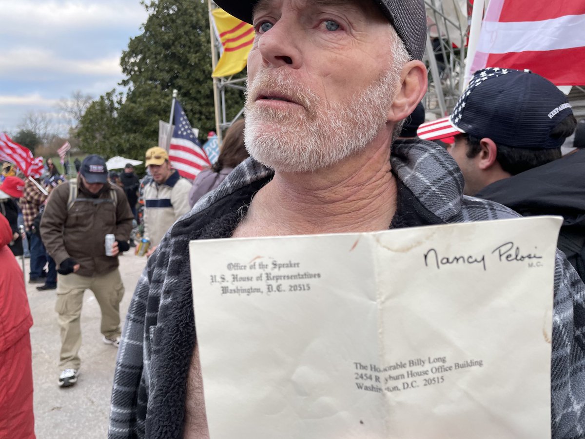 That’s Richard “Bigo” Barnett, 60, from Gravette, Ak., showing off the personalized envelope he took from Speaker Pelosi’s office. He insisted he didn’t steal it — “I left a quarter on her desk.”