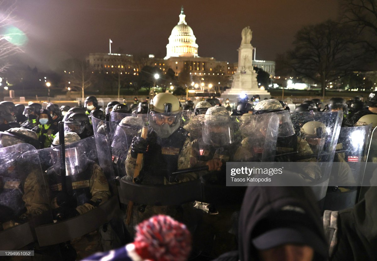Members of the National Guard assist police officers in dispersing protesters who are gathering at the U.S. Capitol Building on January 06, 2021 in Washington, DC.