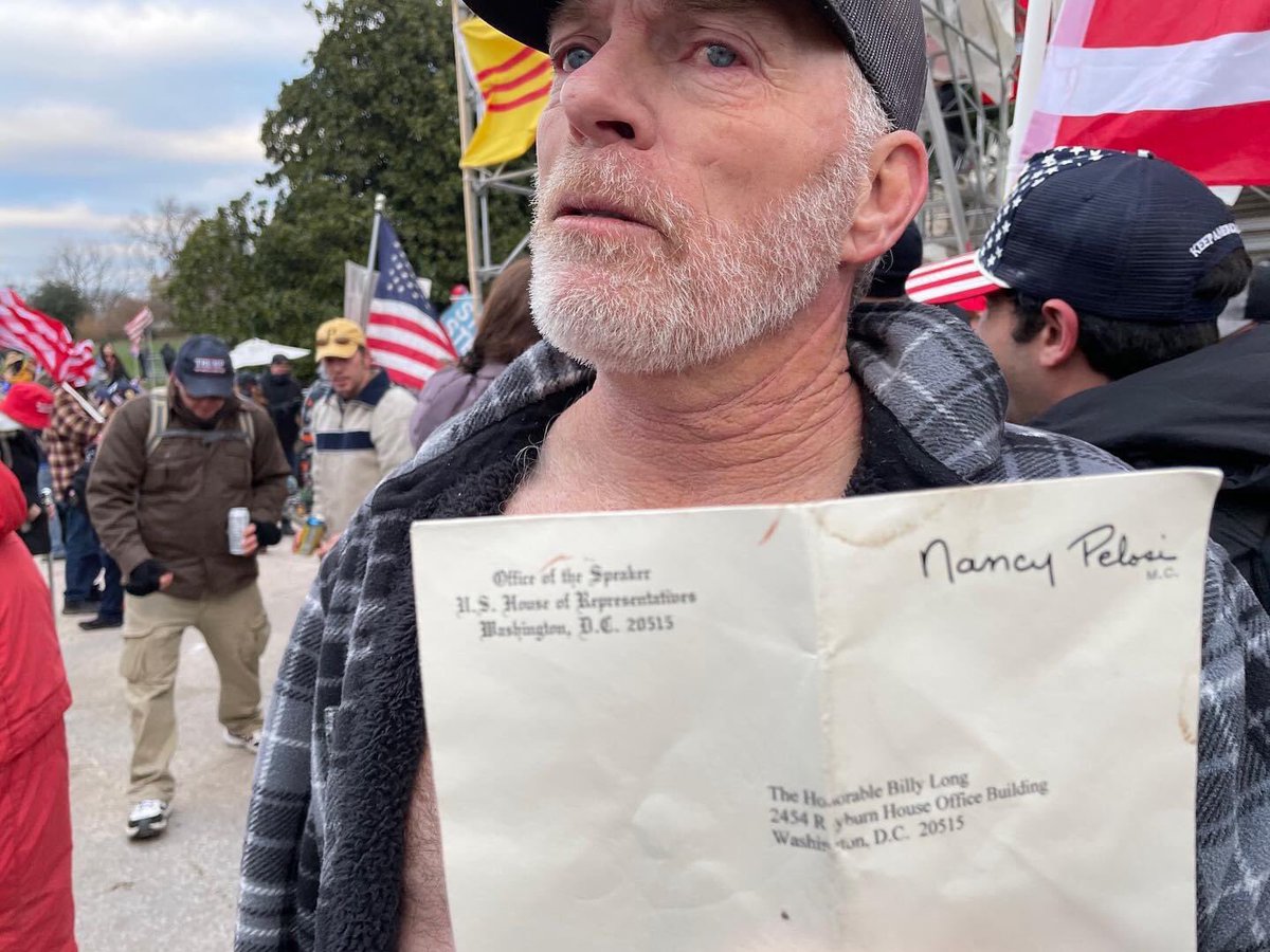 870South's tweet photo. This is Richard Barnett of Gravette, Arkansas posing in Nancy Pelosi’s office. He also posed with stolen mail. He should be arrested immediately. https://t.co/3XfmQbzAVw