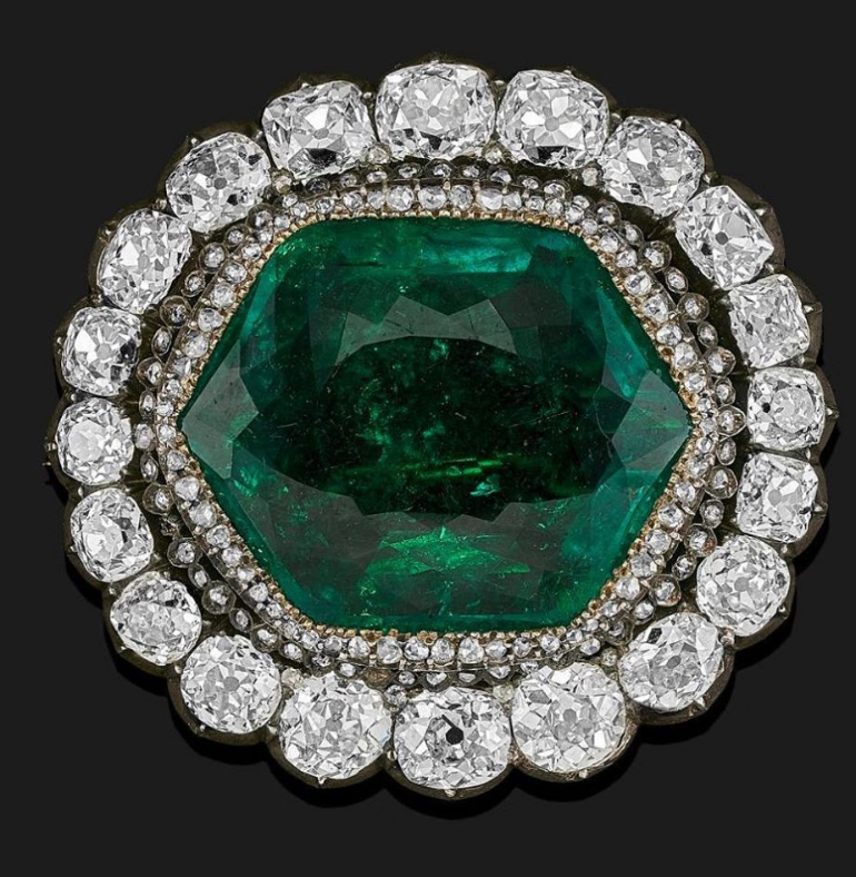 Okay. Body's hidden. An emerald brooch belonging to Catharine the Great. Check the settings. And the old-mine cut diamonds. And the wonky cut on that emerald.