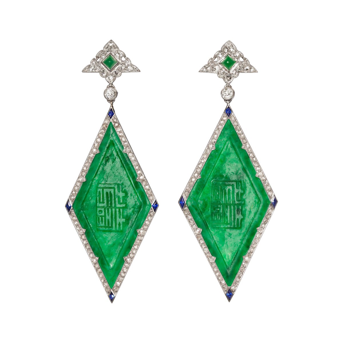 I'm telling you, if you ever want jewelry, hit an antique store before you do anything else. These MIGHT be emerald, but I lean toward jade with the engraving. The blue at the corners (lapis or sapphire?) is a great touch.