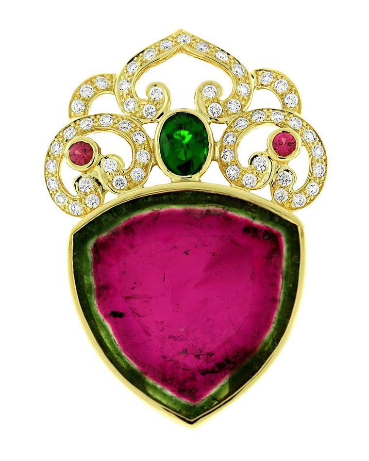 A brooch-pendant from Paula Crevoshay, that's a cross-section of watermelon tourmaline in the big triangle, then an emerald and a couple rubies or more tourmaline, with diamonds for accent. Best watermelon tourmaline treatment I've ever seen.