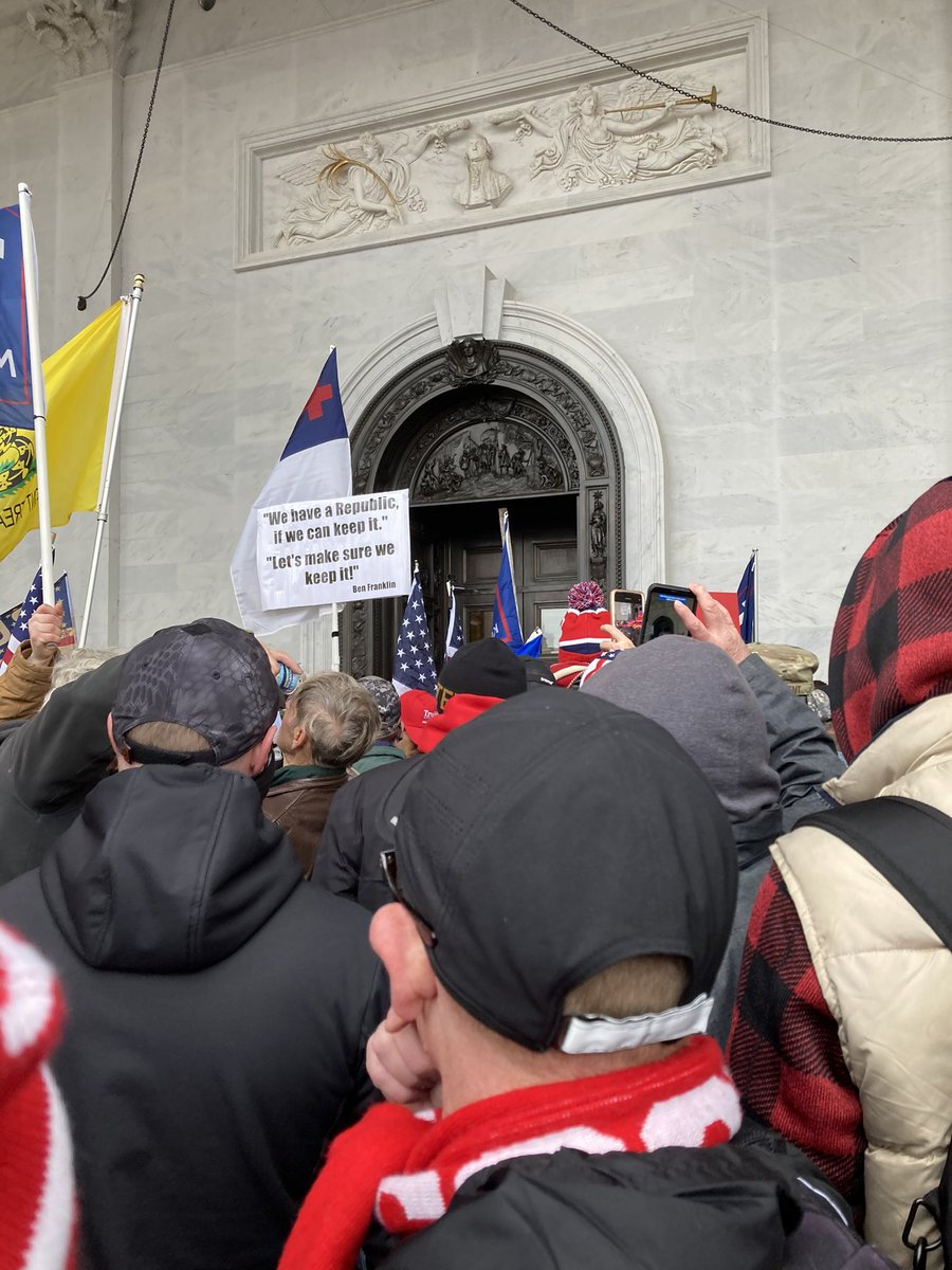 The couple arrived at the door to the Capitol never expecting to get in. Suddenly the doors opened and being pushed from behind by the crowd there was no possible way to do anything but go inside. (Ever been in a mash pit?)