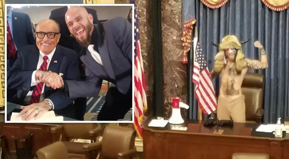 This guy seen today with fur &amp; horns is
Jake Angeli

His Facebook includes a photo of him shaking hands with Rudy Giuliani, Trump's personal attorney who hours before the violence kicked off today encouraged supporters to pursue a "trial by combat"