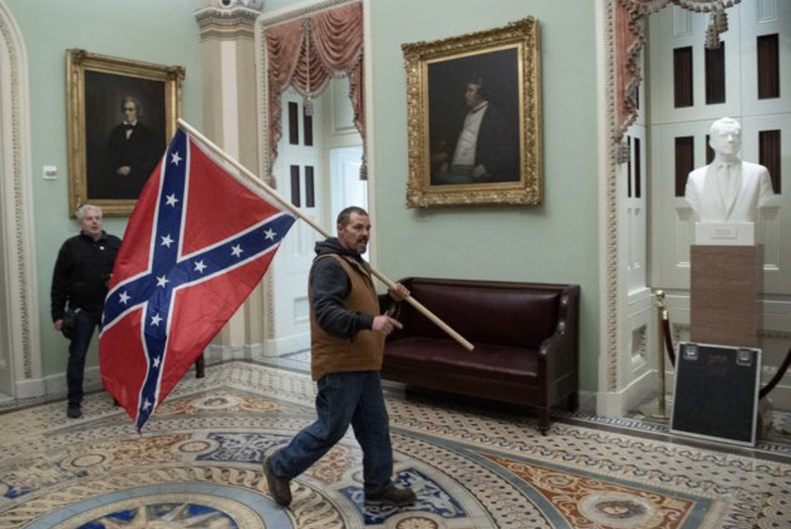 naima's tweet photo. This was the biggest symbolic moment for me today.
The fist time the rebel flag's been paraded through the US Capitol building EVER. 
A direct refute and rejection of the Union. 
Support for a body we fought and beat in war almost 200 years ago. Incited by the SITTING president. https://t.co/ZuY3UzKYuR