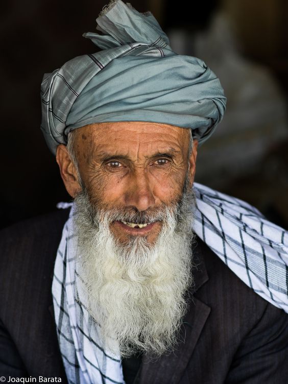 People of Ishkashim: old man at the bazaar.Picture by Joaquin Barata.Ishkashim is split between Tajikistan and Afghanistan. This picture was taken on the Afghanistani side.