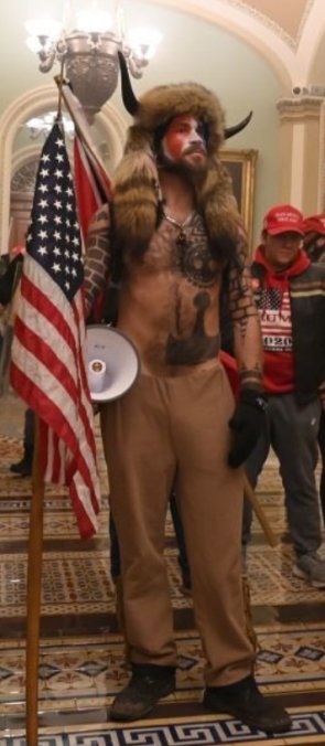 Well its time to talk about this fool I suppose. Trump supporting Q anon fanatic Jake Angeli was with those domestic terrorists who stormed the Capitol on Wednesday. He was on my radar because of the norse imagery poorly tattoed on him. But hes really a Christian. 