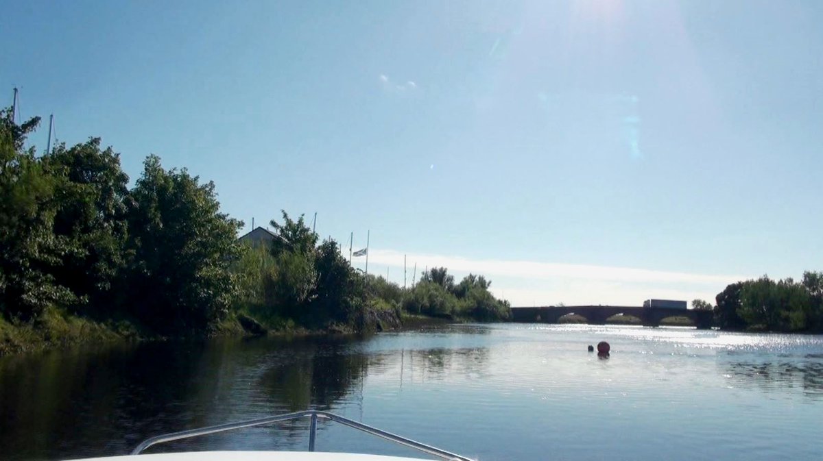 13.The sun now in my eyes and the bridge up ahead, I need to keep close to Port here (left) as this is where the channel is deepest – or risk going aground on the treacherous river bed.