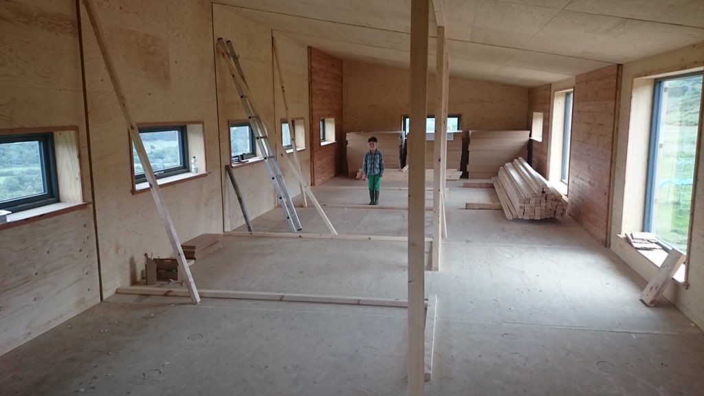 The interior had been taking shape while we waited for the tin to go on. (Upstairs, the youngest, standing where her bedroom would be). If I knew then, what I know now, we’d have taken on a lot more of the interior work ourselves... Shall we say there were a few problems...