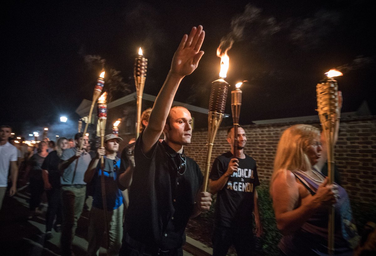 When asked to elaborate, Trump specified who he was talking about:"The night before" that he's referencing was the infamous tiki torch march where neo-Nazis marched around chanting "Jews will not replace us."That's what he was specifically referring to: the tiki torch march.