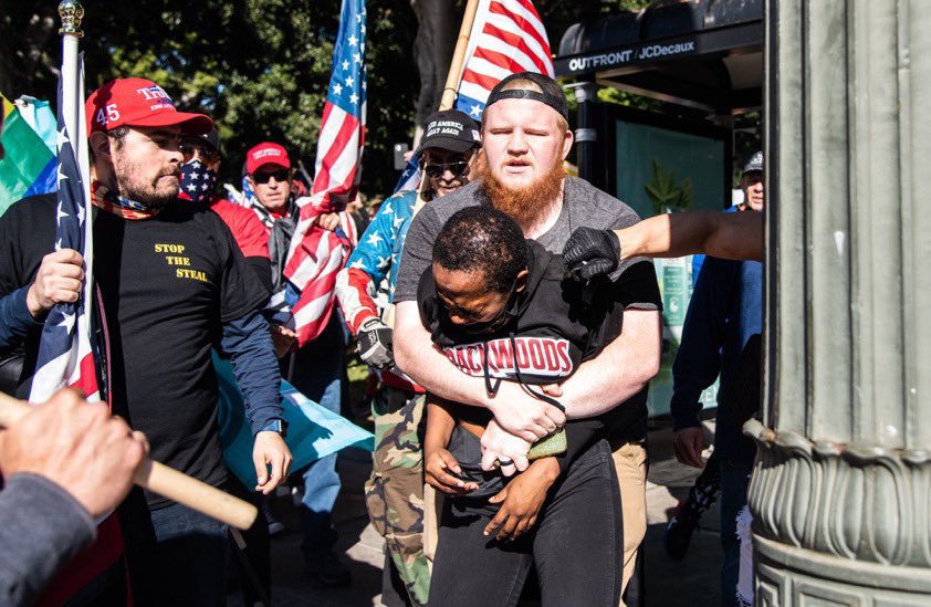 tariqnasheed's tweet photo. A Black woman passing by on her way home was surrounded by a mob of suspected white supremacists who harassed her, beat her, and maced her. 

Not only were no arrests made, one of the suspected white supremacists did a tv interview afterwards https://t.co/4EOy8pgzLo