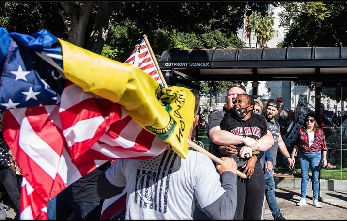 BlackNoChaser's tweet photo. Trigger Warning- these images are infuriating. Photographs and Repost by @rockmyworldrocky - 
“This woman was walking home. 
She lives on (redacted) St. , two blocks away from LA City Hall where a “Stop the Steal” MAGA Rally was taking place. #Losangeles #WashingtonDC https://t.co/sTKROmj4DM