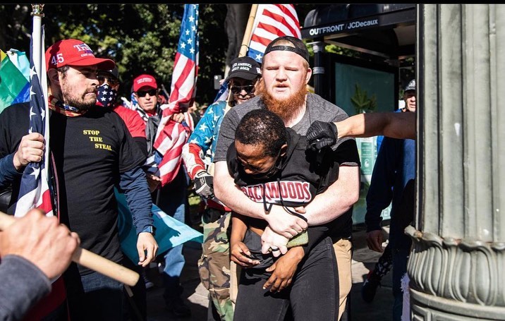 BlackNoChaser's tweet photo. Trigger Warning- these images are infuriating. Photographs and Repost by @rockmyworldrocky - 
“This woman was walking home. 
She lives on (redacted) St. , two blocks away from LA City Hall where a “Stop the Steal” MAGA Rally was taking place. #Losangeles #WashingtonDC https://t.co/sTKROmj4DM