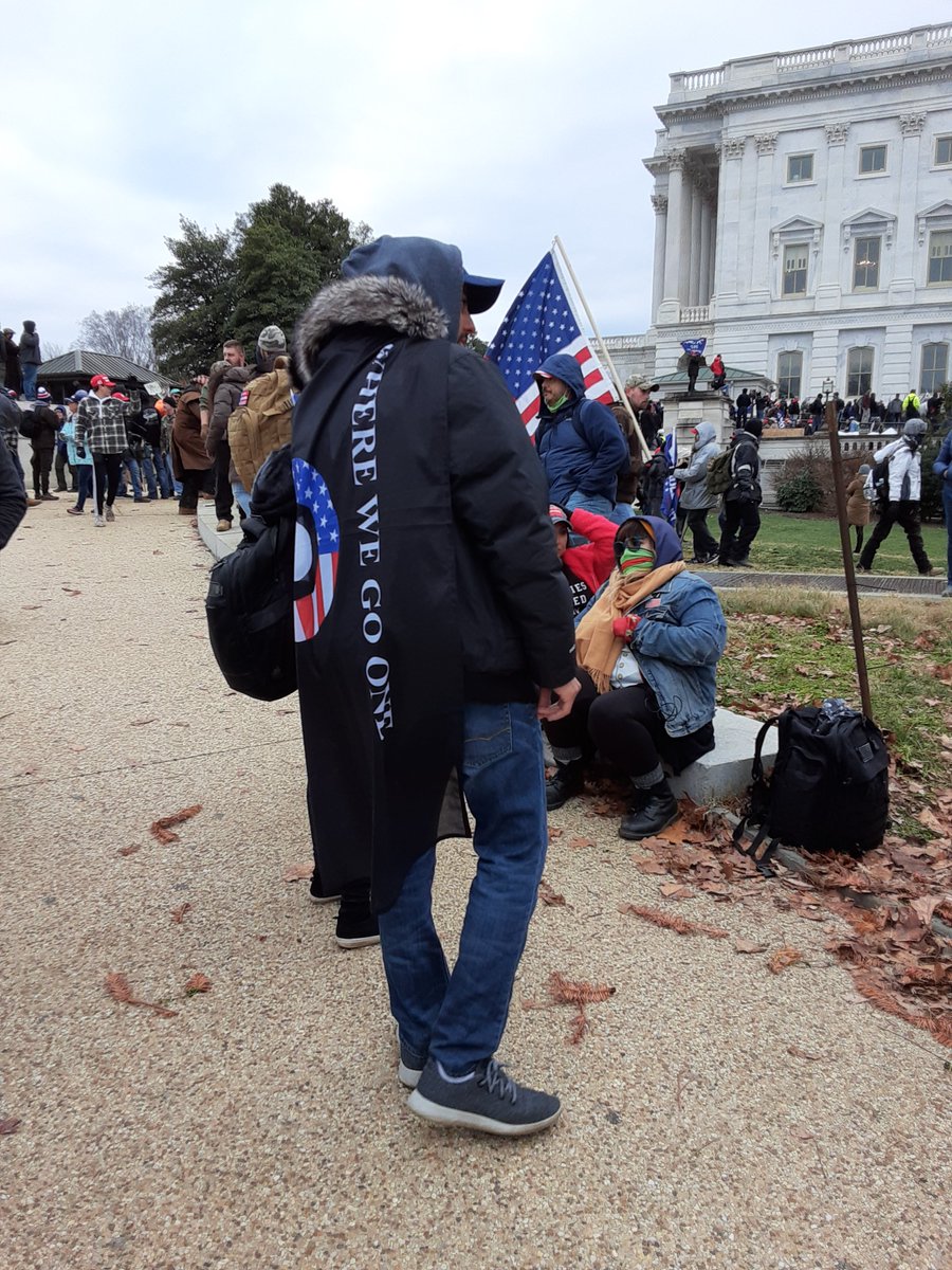 Several groups of QAnon conspiracy theories brought their banners. ("where we go one, we go all" or "WWG1WGA" is their slogan). 5/