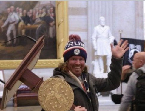 Adam Johnson of Parrish, Florida has been identified as the man caught in a viral photo stealing a lectern from the U.S. House during Wednesday’s violent mob attack on the Capitol.  Why hasn’t he been arrested?